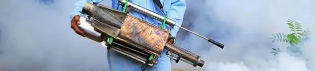 Fumigation technician using a fogger for deep pest treatment in Portland, OR